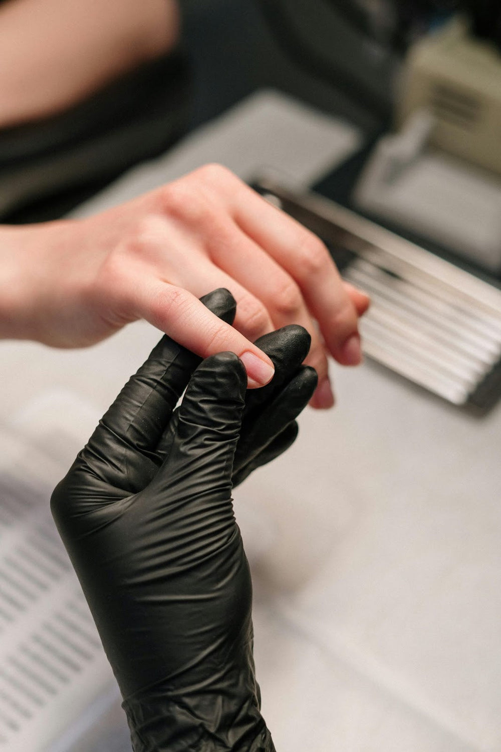Nail Tech Holding Fingernail